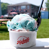 8 oz paper food container, with red "Michael's" logo, filled with blue and pink ice cream with a spoon, outside