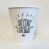 12 oz double-walled paper cup with black "Good Morning! Caffeine is part of the Experience" text, standing on white background
