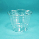Blank 9 oz plastic cup standing on blue background