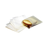 Stack of white sandwich bags fanned out, with a sandwich inside the top bag, on a white background